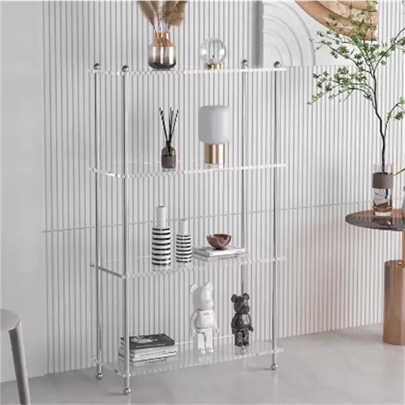 Tall four-tier clear acrylic shelf with metal posts holding decor
